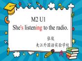 小学英语外研版2B Unit1 She's listening to the radio 部优课件
