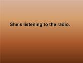 二年級下冊英語課件- Module 2 Unit 1 She's listening to the radio.   外研社（一起）